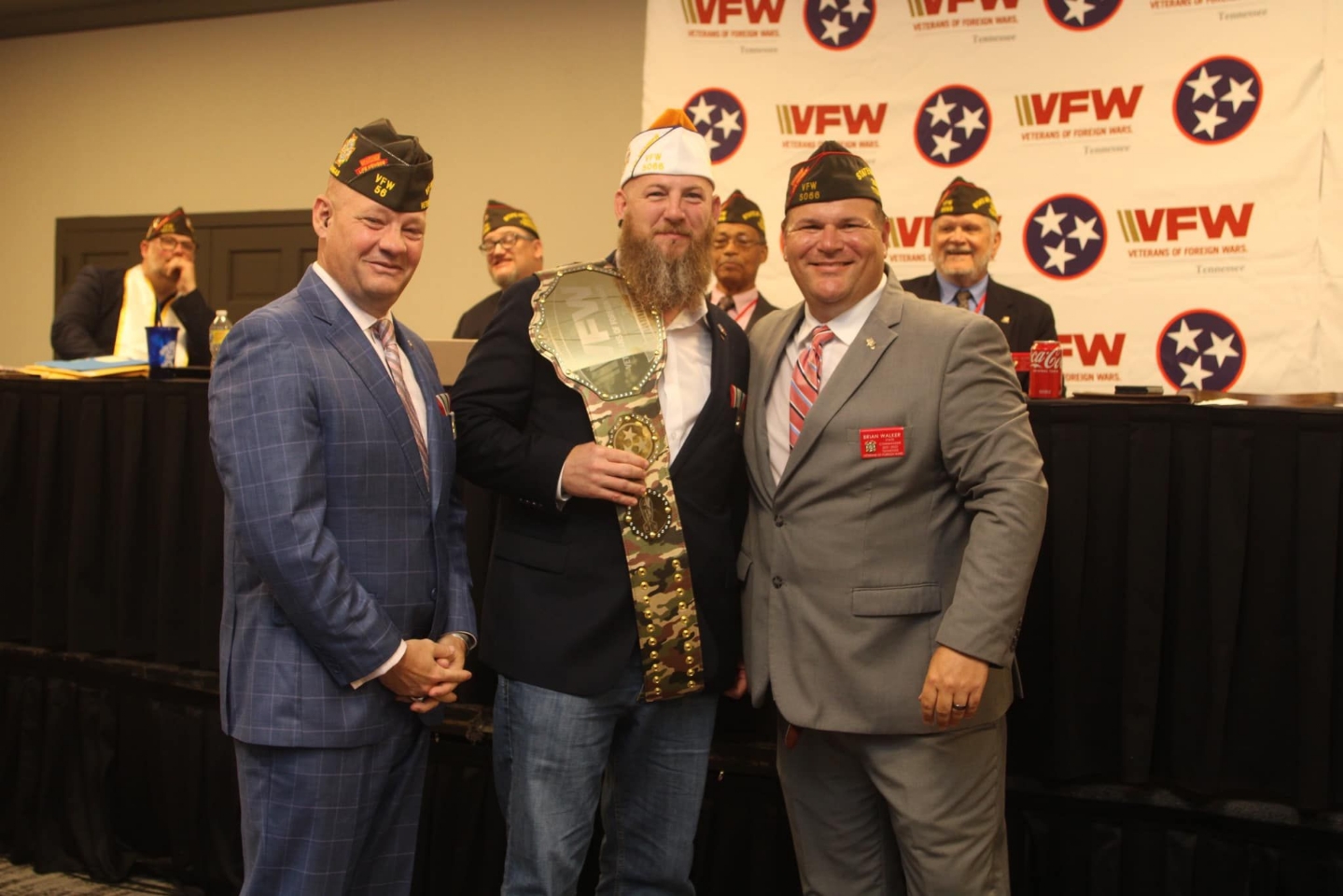 Daniel Basden accepting the Post Community Service Award Championship Belt at the Tennessee State Convention in Nashville, TN. (left to right are Lynn Rolff, Daniel Basden, Brian Walker)